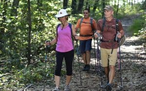 Three adults hiking on Tellico trails for article, Trail Building at Tellico Village Image