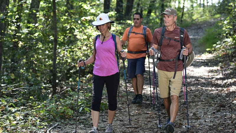 Three adults hiking on Tellico trails for article, Trail Building at Tellico Village Image