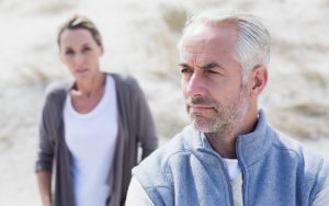 couple arguing at beach Wavebreakmedia Ltd Dreamstime. For article, A woman discovers a suspicious pic in her husband’s phone, of a woman he had an affair with many years ago. What does Ask Amy say? Image
