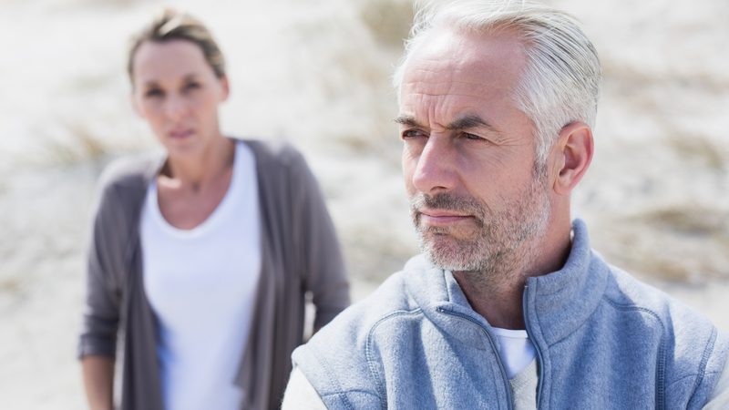 couple arguing at beach Wavebreakmedia Ltd Dreamstime. For article, A woman discovers a suspicious pic in her husband’s phone, of a woman he had an affair with many years ago. What does Ask Amy say? Image