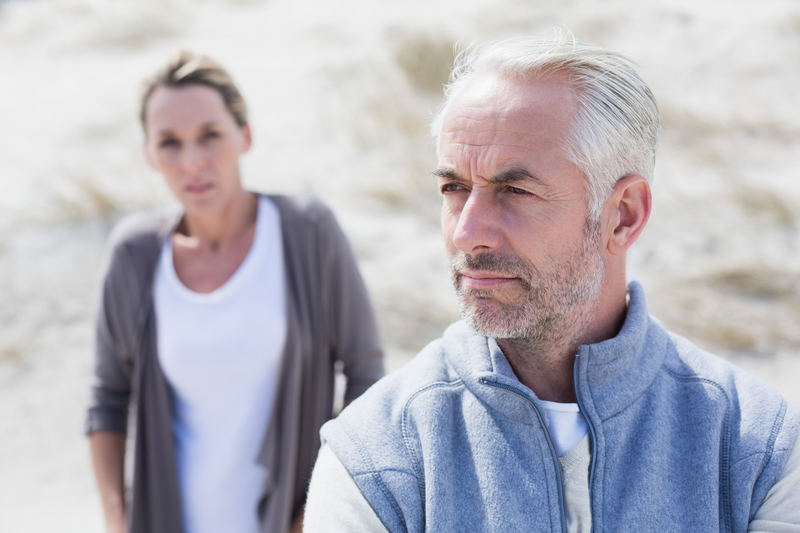 couple arguing at beach Wavebreakmedia Ltd Dreamstime. For article, A woman discovers a suspicious pic in her husband’s phone, of a woman he had an affair with many years ago. What does Ask Amy say?