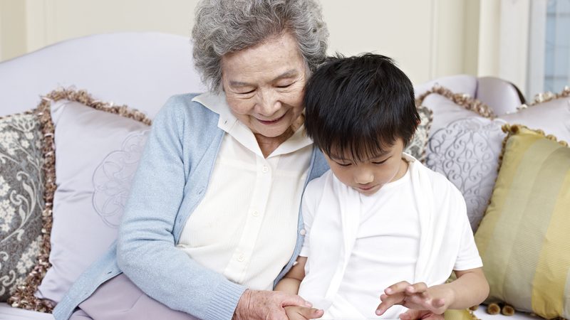grandmom grandson on tablet puzzle Imtmphoto Dreamstime Image