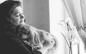 sad woman with dog Photo by Tetiana Nazarenko Dreamstime. For article, Ask Amy responds to a reader who is in need of comfort after a pet’s death, feeling guilty after painful treatments to extend the dog’s life. Image