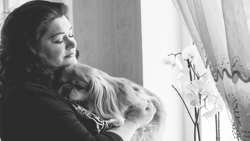 sad woman with dog Photo by Tetiana Nazarenko Dreamstime. For article, Ask Amy responds to a reader who is in need of comfort after a pet’s death, feeling guilty after painful treatments to extend the dog’s life.