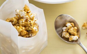 The hardest part of this recipe is waiting for your DIY caramel popcorn to cool before you eat it! Image