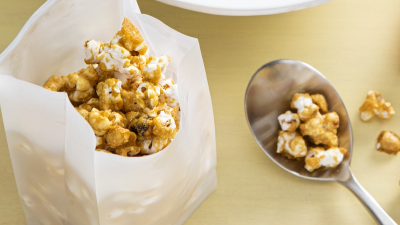The hardest part of this recipe is waiting for your DIY caramel popcorn to cool before you eat it! Image