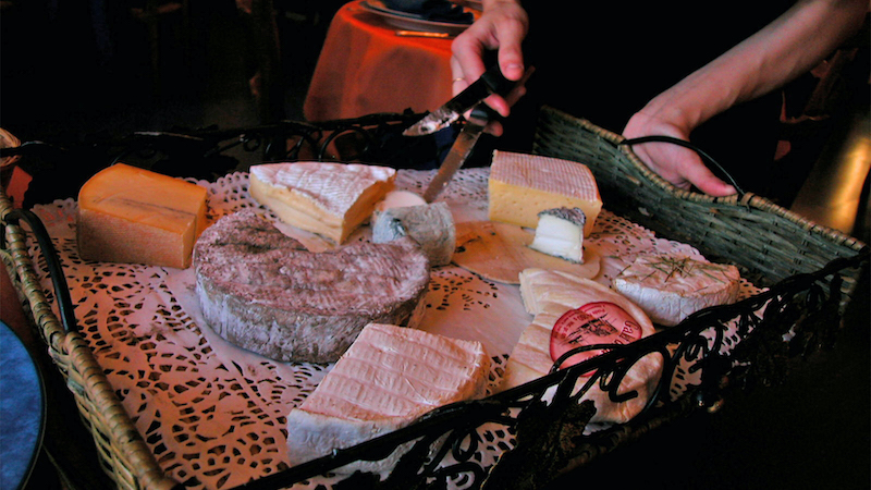 A plate of cheese: To explore both the country and the barn, think of the cheese course as a tour of France. A French restaurant experience offers "a long, drawn-out dinner splurge as a wonderful investment of both time and money," says Rick Steves.