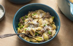 One-pot pasta: This pasta absorbs lots of flavor cooking in the same pot as the sauce. For recipe, America’s Test Kitchen brings us their tested recipe for one-pot pasta: pasta shells, sausage, peas, and cheese. One pot = easy cleanup! Image