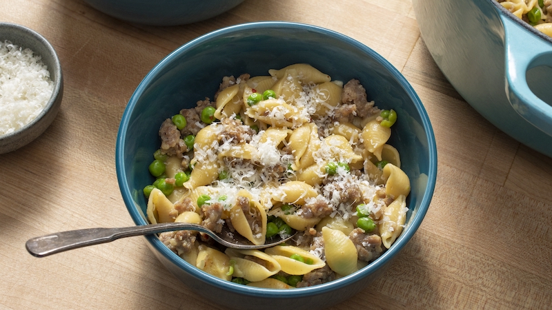 One-pot pasta: This pasta absorbs lots of flavor cooking in the same pot as the sauce. For recipe, America’s Test Kitchen brings us their tested recipe for one-pot pasta: pasta shells, sausage, peas, and cheese. One pot = easy cleanup! Image