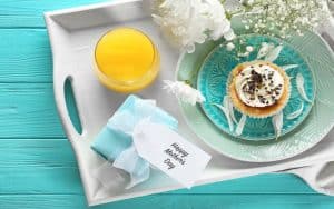 A pretty tray for a Mother's Day breakfast in bed. These creative tips can help you prepare for Mother's Day, to let your mum know much much you truly care, from gift ideas to feasts. Image