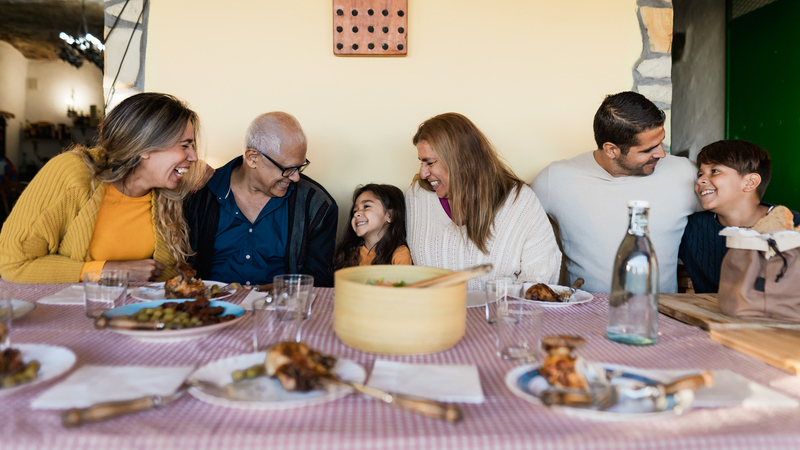 family fun at mealtime Photo by Alessandro Biascioli Dreamstime. For article, Her mother-in-law's cooking makes people sick! See what Ask Amy advises the daughter-in-law, who values tasty, healthy family meals.