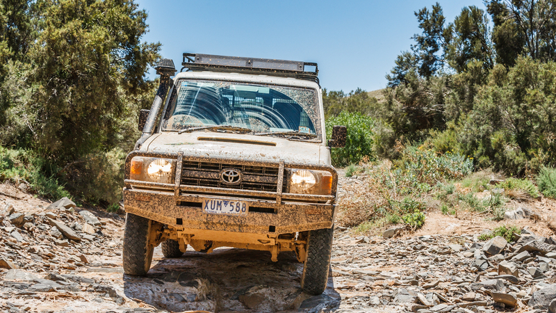 Toyota Land Cruiser drives through a dry river bed in the Arkaroola Wilderness. Image by Henk Van Den Brink, Dreamstime. For article, Matching car names to drivers, wherein Nick Thomas takes the humorous route.