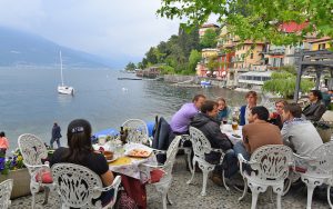 Romantic lakeside dining in Varenna, Italy. Rick Steves transports readers to sleepy Lago di Como – aka Lake Como or Lario – a relaxing, romantic resort town in a suggestive location. Image