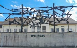 Image of the sculpture to remember the victims of Dachau. Travel writer Rick Steves takes us through the Dachau concentration camp, where visitors are reminded: “Forgive, but never forget.” Image