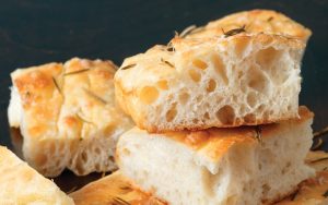 America’s Test Kitchen brings us their tested recipe for Roman-style focaccia, a soft, delicious bread that’s like a traditional pizza bianca. Image