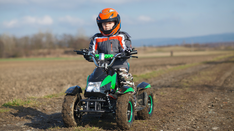 Young child on an ATV. Despite parents' rules, in-laws take the 5-year-old grandson on ATV rides. See what Ask Amy says when grandparents ignore parents’ requests. Image