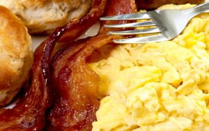 country breakfast with scrambled egg, bacon, and biscuits. photo by Danny Hooks Dreamstime. Food and travel writer Steve Cook visits Eat 33 Diner on Staples Mill in Richmond, VA, and revisits memories from breakfasts long ago. Image