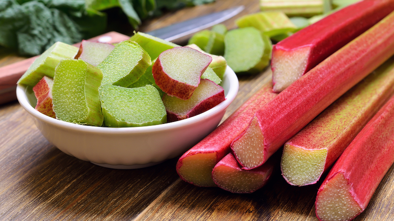 fresh rhubarb on a kitchen table. photo by Nadin333 Dreamstime