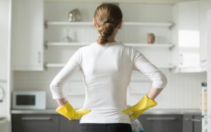woman cleaning kitchen photo by Fizkes Dreamstime. Cleaning is a dreaded task, but these six clever cleaning hacks for a spotlessly sparkling house make housecleaning a breeze. Image