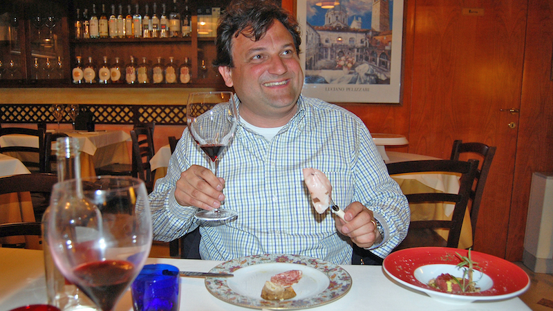 Rick Steves' friend Franklin: at Enoteca Can Grande, a small restaurant in Verona, Italy, travel writer Rick Steves and his friend Franklin savor the unforgettable cuisine and extol the virtues of Italian food. Image