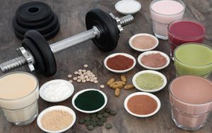 dumbbells and health food and multiple suspect supplements. Photo by Marilyn Barbone Dreamstime Image