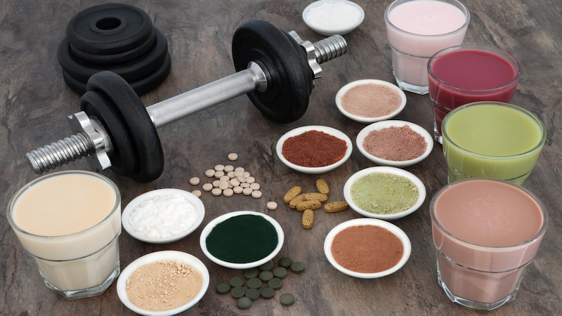 dumbbells and health food and multiple suspect supplements. Photo by Marilyn Barbone Dreamstime