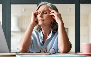 stressed woman at work photo by. Dark1elf Dreamstime. For article on fighting ageism in the workplace. Image
