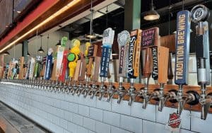 back of the bar taps. We look at 101 Crafthouse/USA Growler in Midlothian, VA, serving up a diversity of craft beer alongside pizza and other bar food options. Image