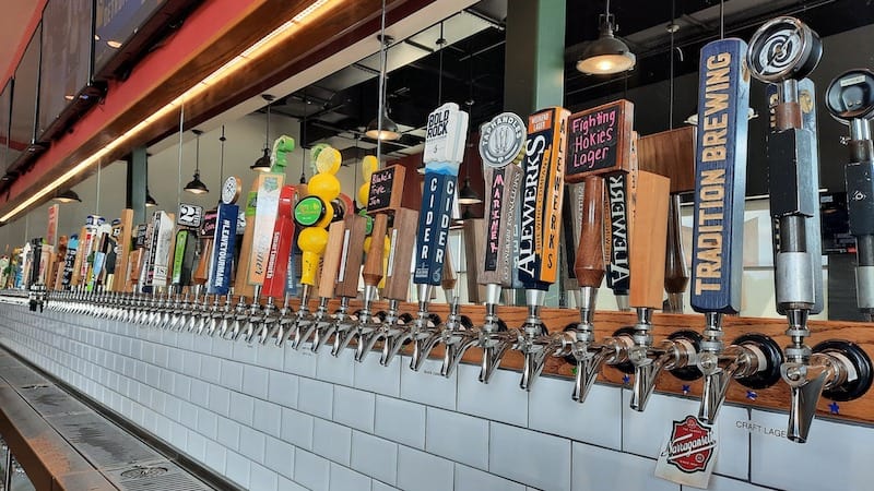 back of the bar taps. We look at 101 Crafthouse/USA Growler in Midlothian, VA, serving up a diversity of craft beer alongside pizza and other bar food options. Image