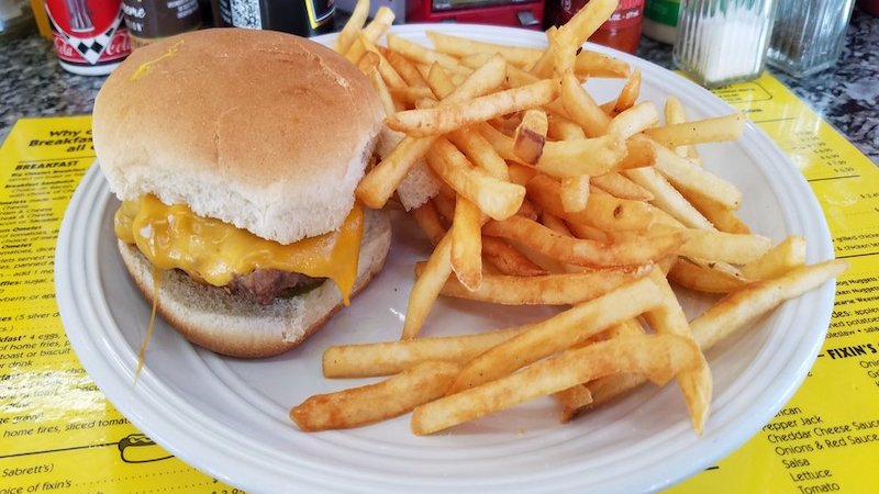 cheeseburger and fries. Food writer Steve Cook shares a tiny spot that serves some of the best grilled burgers and hot dogs in Richmond, Pop's Dogs & Ma's Burgers.