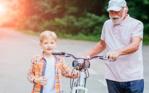 active granddad pushing a bike with grandson photo by Iryna Inshyna Dreamstime. Will wearing a brace help prevent injury and relieve aches and pains? We examine a variety of braces: ankle, knee, wrist; types; and more. Image
