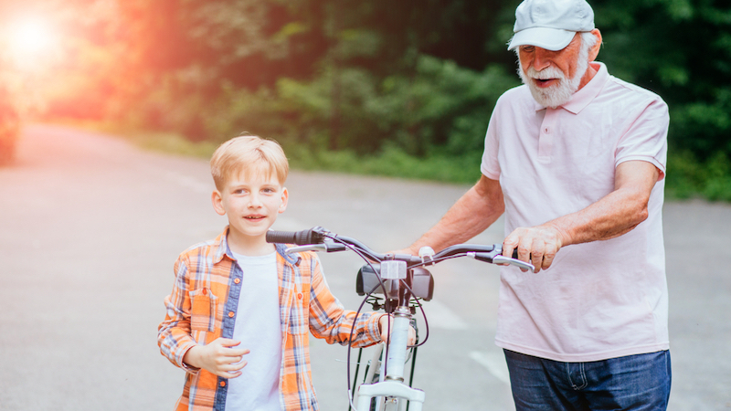 active granddad pushing a bike with grandson photo by Iryna Inshyna Dreamstime. Will wearing a brace help prevent injury and relieve aches and pains? We examine a variety of braces: ankle, knee, wrist; types; and more.