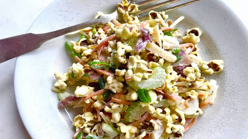 Popcorn salad stars at Midwest picnics and barbecues, a surprisingly delicious retro side dish with a satisfying crunch. Image