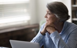 distracted woman at work, Photo by Fizkes, Dreamstime. mindful meditation for improving focus – including two Buddhist-based meditation styles: focused attention (FA) meditation and open monitoring (OM) meditation. Image