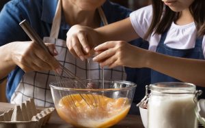 grandmom and grandkid making eggs. Photo by Fizkes, Dreamstime. These three easy-to-make, delicious, kidney-friendly recipes help caregivers provide nutritious meals for elderly parents in their care. Image