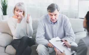 wife and husband in therapists' office. Photo by Prostockstudio, Dreamstime, for Ask Amy advice column on woman married to an 'empty shell' of a husband Image