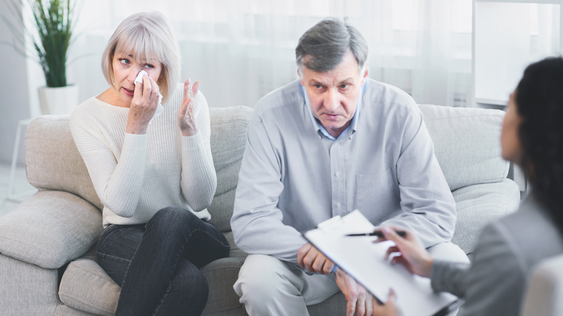 wife and husband in therapists' office. Photo by Prostockstudio, Dreamstime, for Ask Amy advice column on woman married to an 'empty shell' of a husband