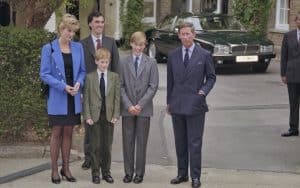 British Royal Diana, Princess of Wales (1961-1997), wearing a blue jacket over a black dress, with Eton housemaster Dr. Andrew Gailey, Prince Harry, Prince William, and Prince Charles outside Manor House on Prince William's first day at Eton College in Eton, Berkshire, England, Sept. 16, 1995. (Princess Diana Archive/Hulton Archive/Getty Images/TNS). “The Princess,” a Princess Diana documentary Image