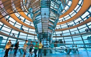 Inside the dome of the Reichstag, Germany's parliament building. Travel writer Rick Steves recalls his visit to Berlin’s Reichstag – the German parliament building – and digs beneath the entertainment value of travel to examine its value in understanding history, broadening our perspectives, and understanding current events more fully. Image