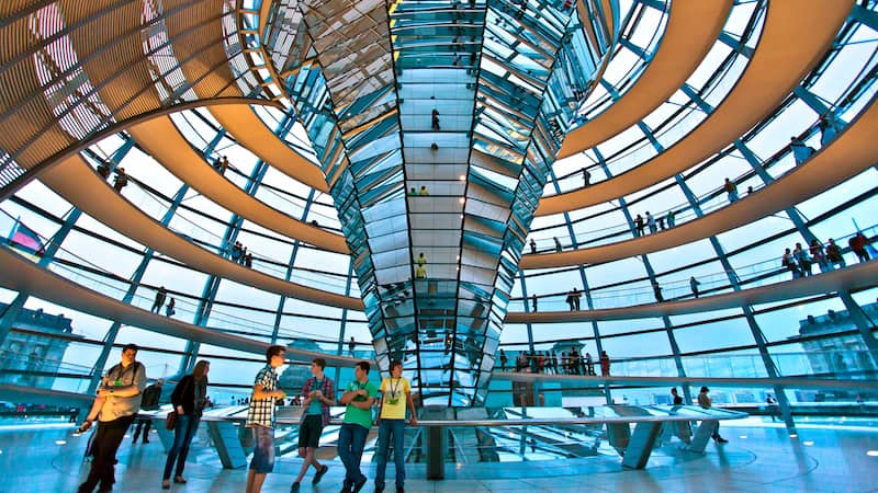 Inside the dome of the Reichstag, Germany's parliament building. Travel writer Rick Steves recalls his visit to Berlin’s Reichstag – the German parliament building – and digs beneath the entertainment value of travel to examine its value in understanding history, broadening our perspectives, and understanding current events more fully. Image