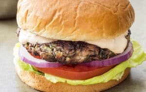 Served with complementary toppings like tomatoes and avocado, Southwestern Black Bean Burgers make a healthy, hearty, protein-powered main. Image