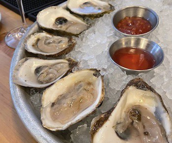 platter of raw oysters with cocktail sauce. Food and travel writer Steve Cook stumbles upon an unexpected find near the Blue Ridge Mountains in Virginia: a restaurant teeming with seafood, Public Fish & Oyster in Charlottesville.