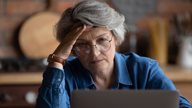Concerned woman looking at laptop. Photo by Fizkes, Dreamstime. Longtime friends ghosted her and cut off contact, but now she is concerned for their health. Should she reach out? See what Ask Amy says. Image
