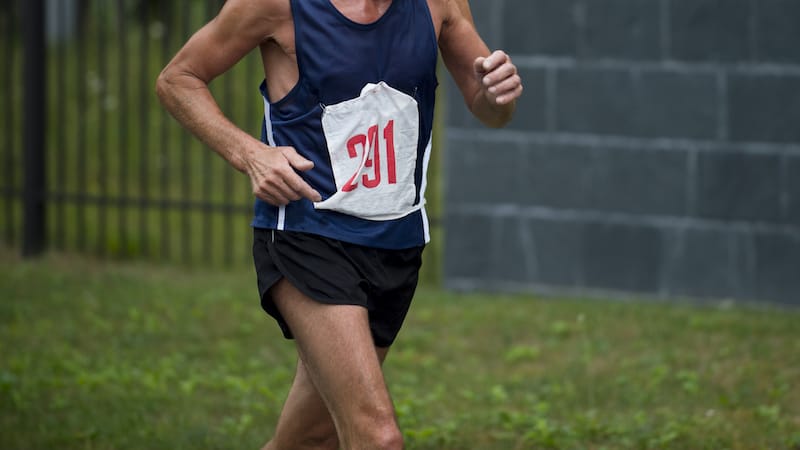 an older man running in a race. For article on the tall lithe brunette that passed the man, then lost to him at the end. Image
