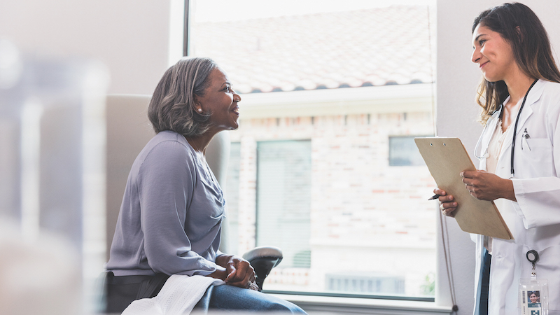 woman and doctor. Clinical trials examine safety and effectiveness of new treatments in people and help develop ways to prevent, detect and treat diseases.