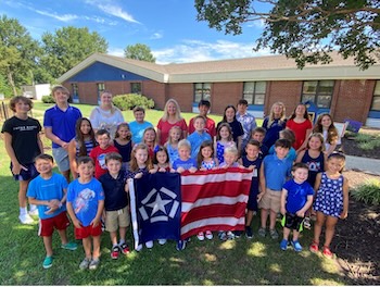 Richmond teacher and author Tara R. Krohn (pictured below) wrote a children’s book titled, “Unfurling the Freedom Flag – A 9/11 Story,” enabling this amazing local story to be shared across the country and beyond.