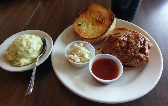 barbecue chicken sandwich with potato salad and Cole slaw at The Pickel Barrel.