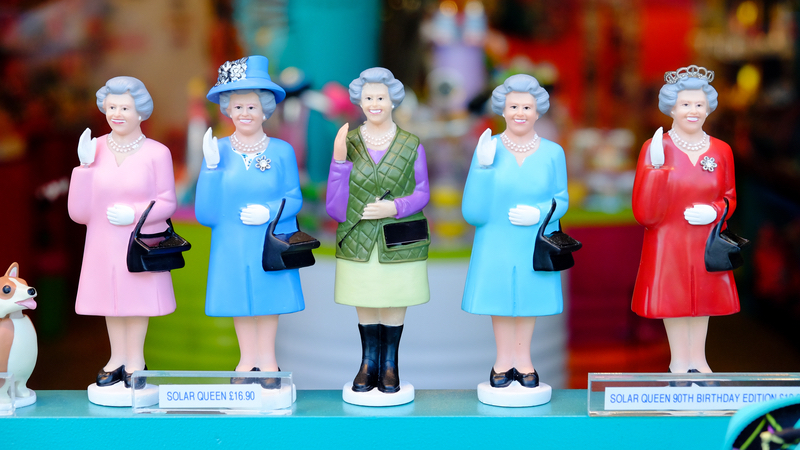 Queen dolls in a shop window. Photo by Nuii7711, Dreamstime. Writer and humorist Nick Thomas probes the royal humor of Queen Elizabeth II, her husband, and her successor and speculates on other lost opportunities at regal fun. Image