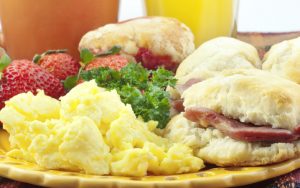 country breakfast with flaky biscuits and country ham, scrambled eggs, fresh strawberries, coffee and orange juice. Photo by Cheryl Davis, Dreamstime. Boomer goes to The Pickel Barrel for comfort food that will satiate your belly, from flaky biscuits with country ham to Southern supper gems. Image