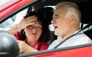 couple arguing in car. Photo by Andrey Popov, Dreamstime. A wife has developed Amaxophobia, a fear of riding in a vehicle, but her husband continues to be a reckless driver. What does Ask Amy advise? Image